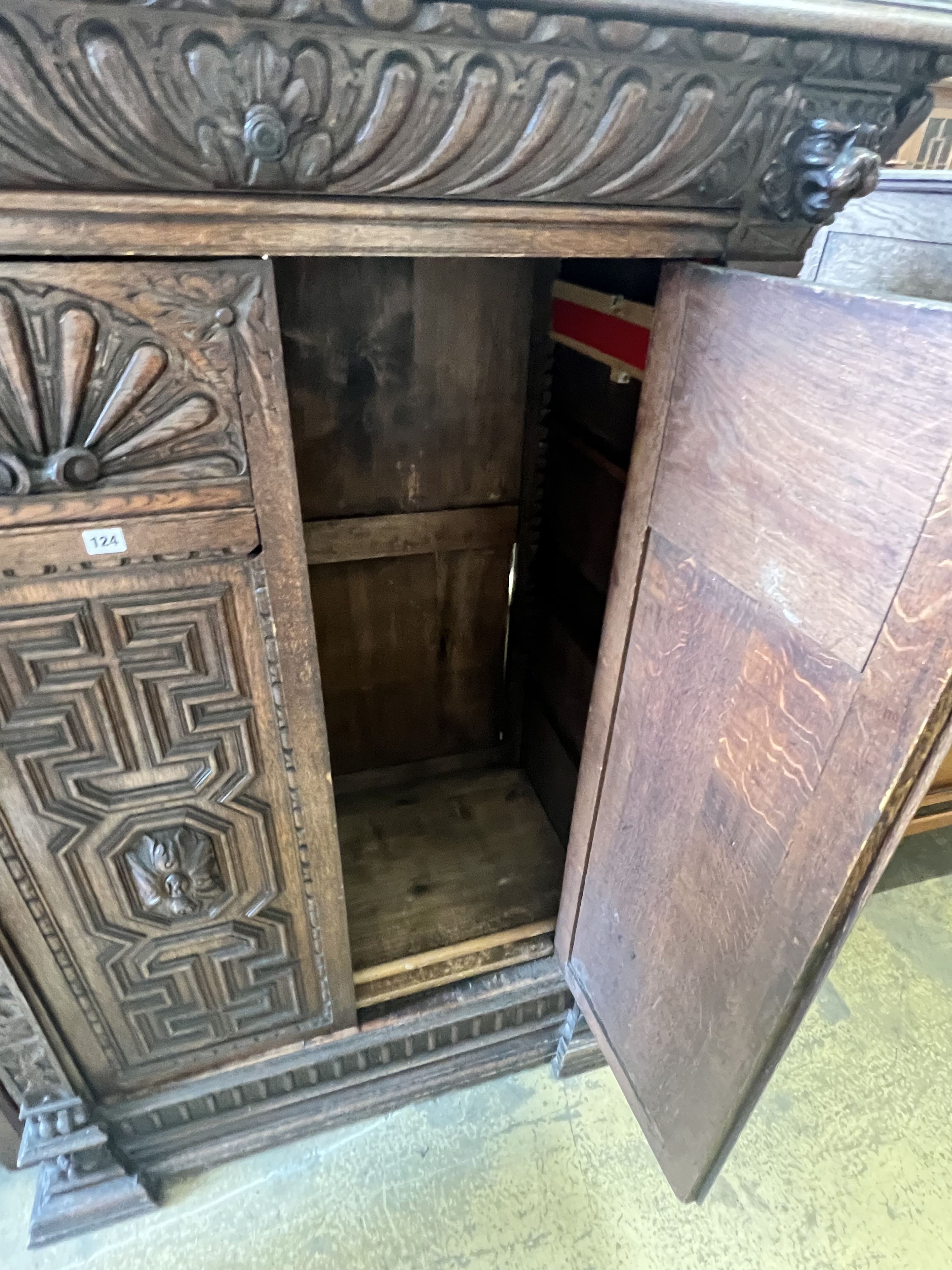 A Jacobean revival carved oak press cupboard, width 115cm depth 63cm height 156cm